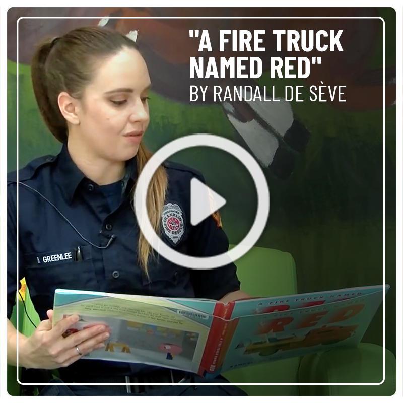 Firefighter Brittany Greenlee reads "A Fire Truck Named Red” by Randall de Sève