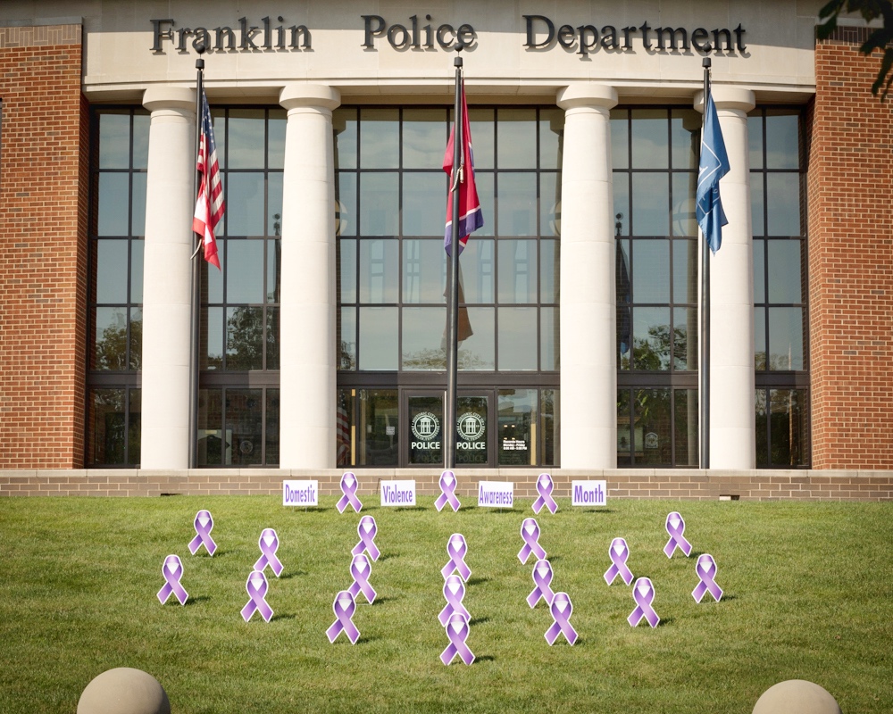 Police HQ lawn with domestic violence ribbons decorating it